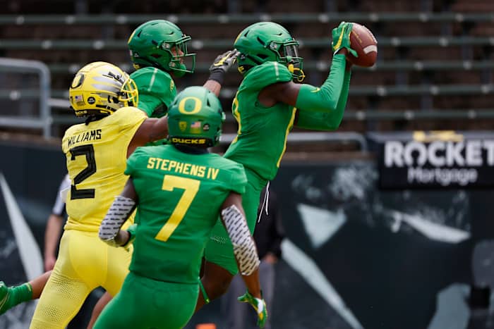 Dontae Manning intercepts a wide receiver reverse pass from Mycah Pittman in Oregon's 2021 spring football game.